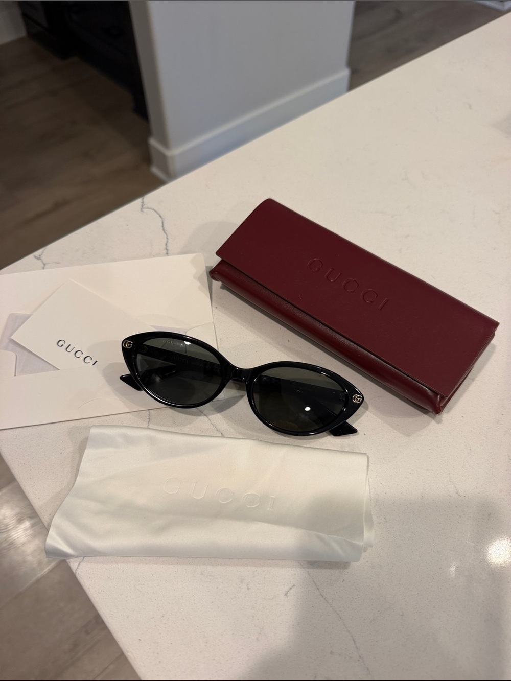 Gucci Black Cat-Eye Sunglasses with Burgundy Case
